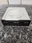 Asus DRW-241ST Rewritable Sata Optical Disk Drive. Fixed Price $23.99.